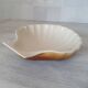 Brown and white ceramic shell bowl