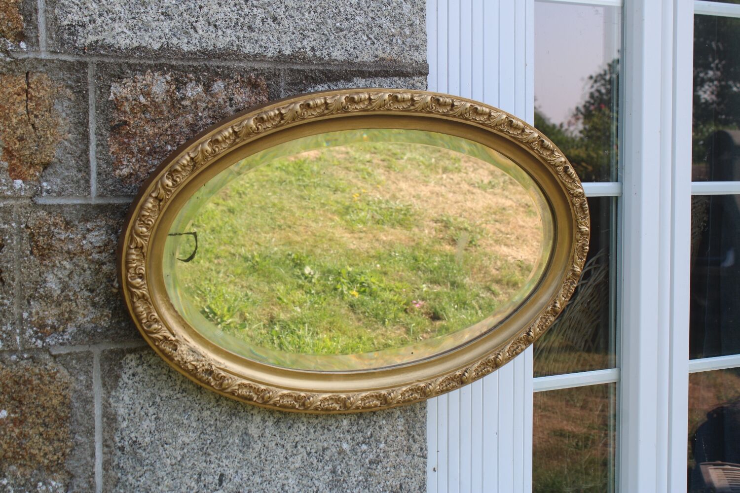 Bevelled oval antique mirror