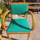 3 vintage bridge chairs with rounded armrests.