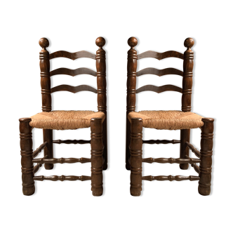 Pair of solid wooden chairs and mulched seat