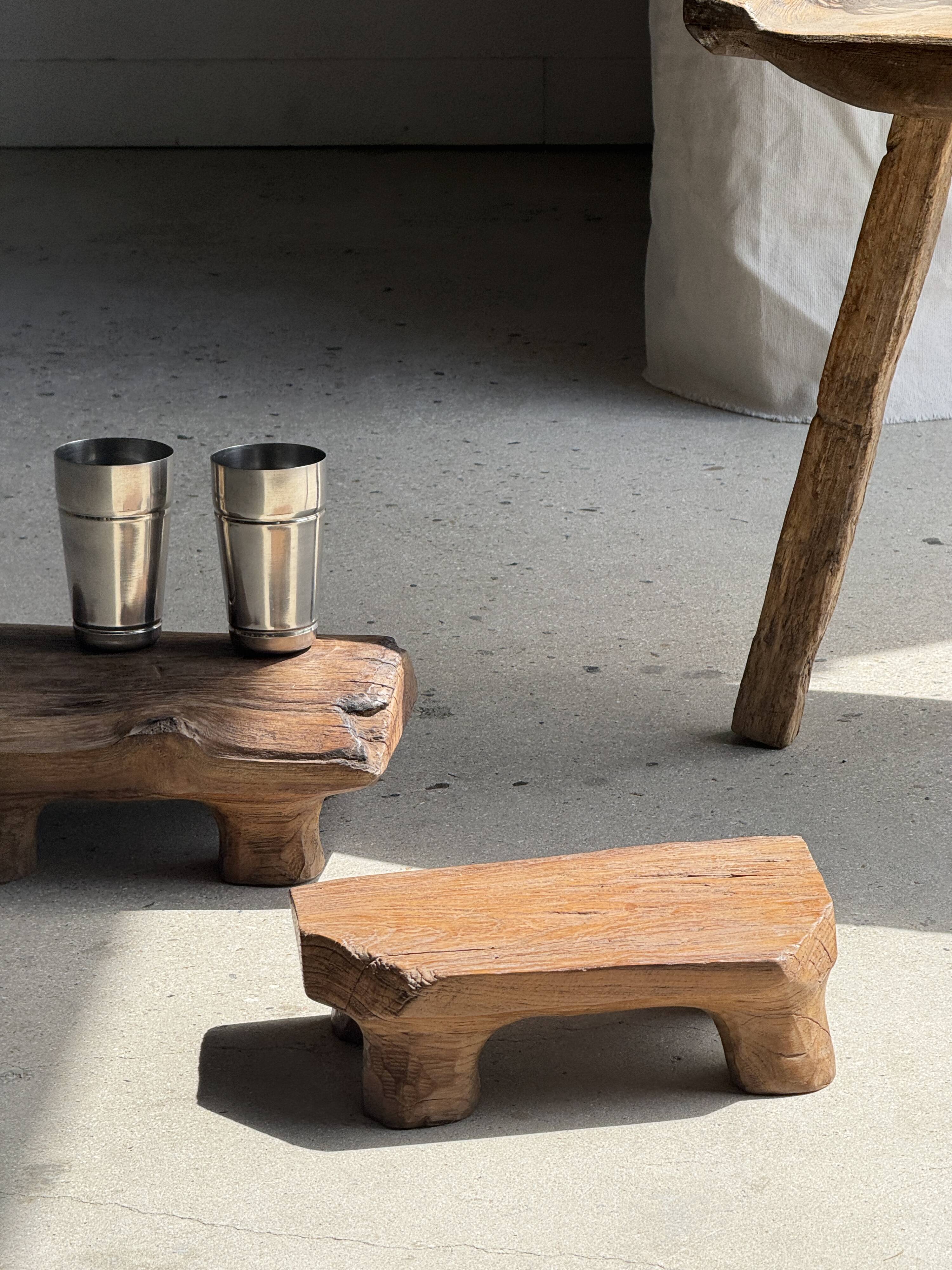 Small stool, teak footrest with short cut corners.
