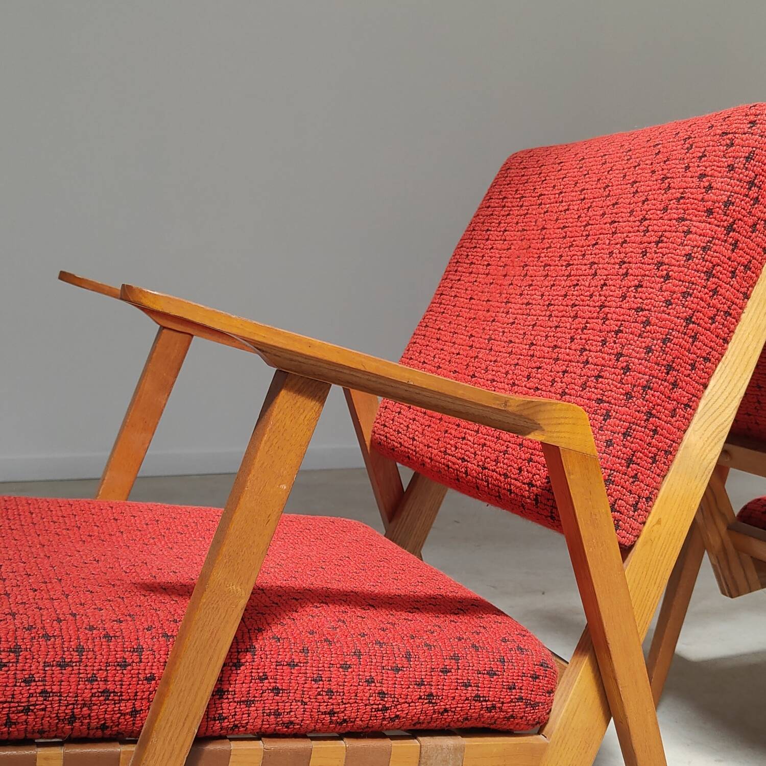 Pair of armchairs in mottled red and wood by Uluv, former Czechoslovakia 1960