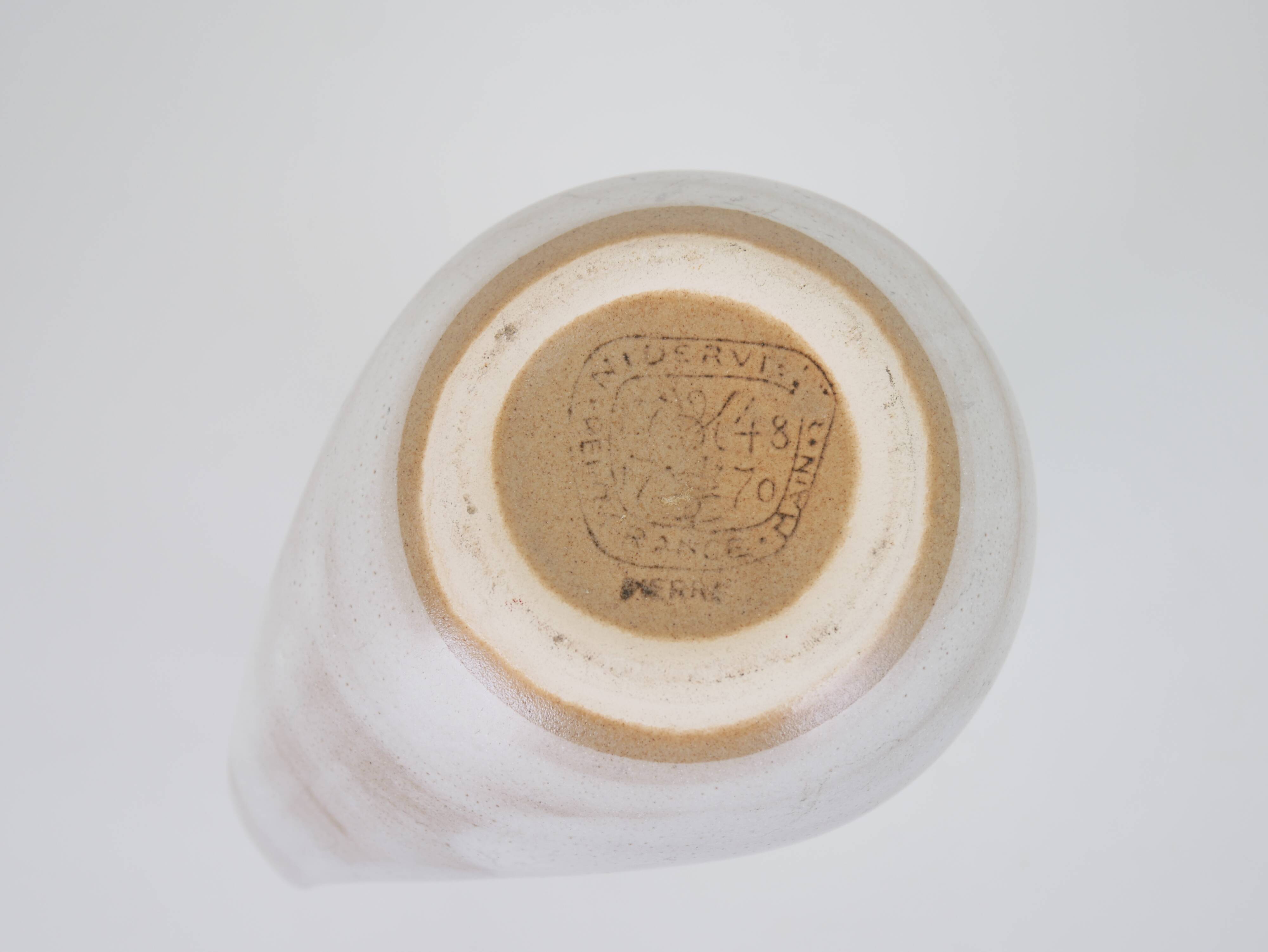 Signed white beige ceramic pitcher