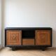 Buffet in Art Deco style made of blackened wood and carved oak.