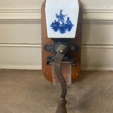 Old wall-mounted coffee grinder