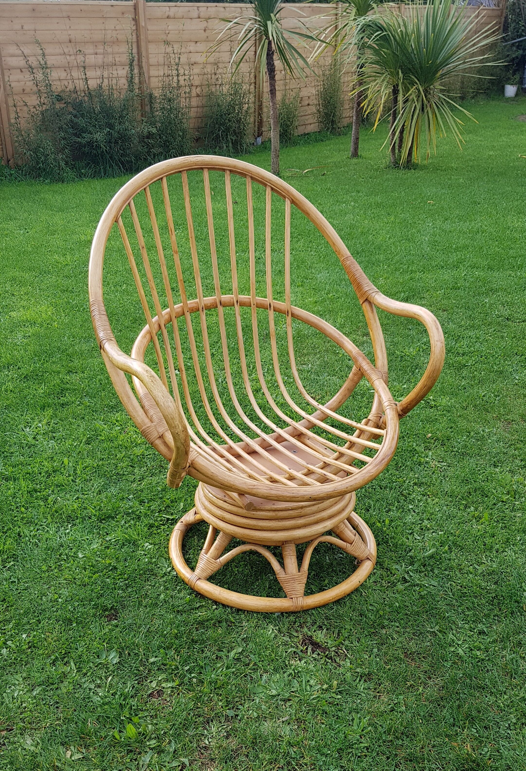 Pair of swivel rattan armchairs