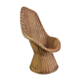 High-backed chair or shepherdess in vintage wicker