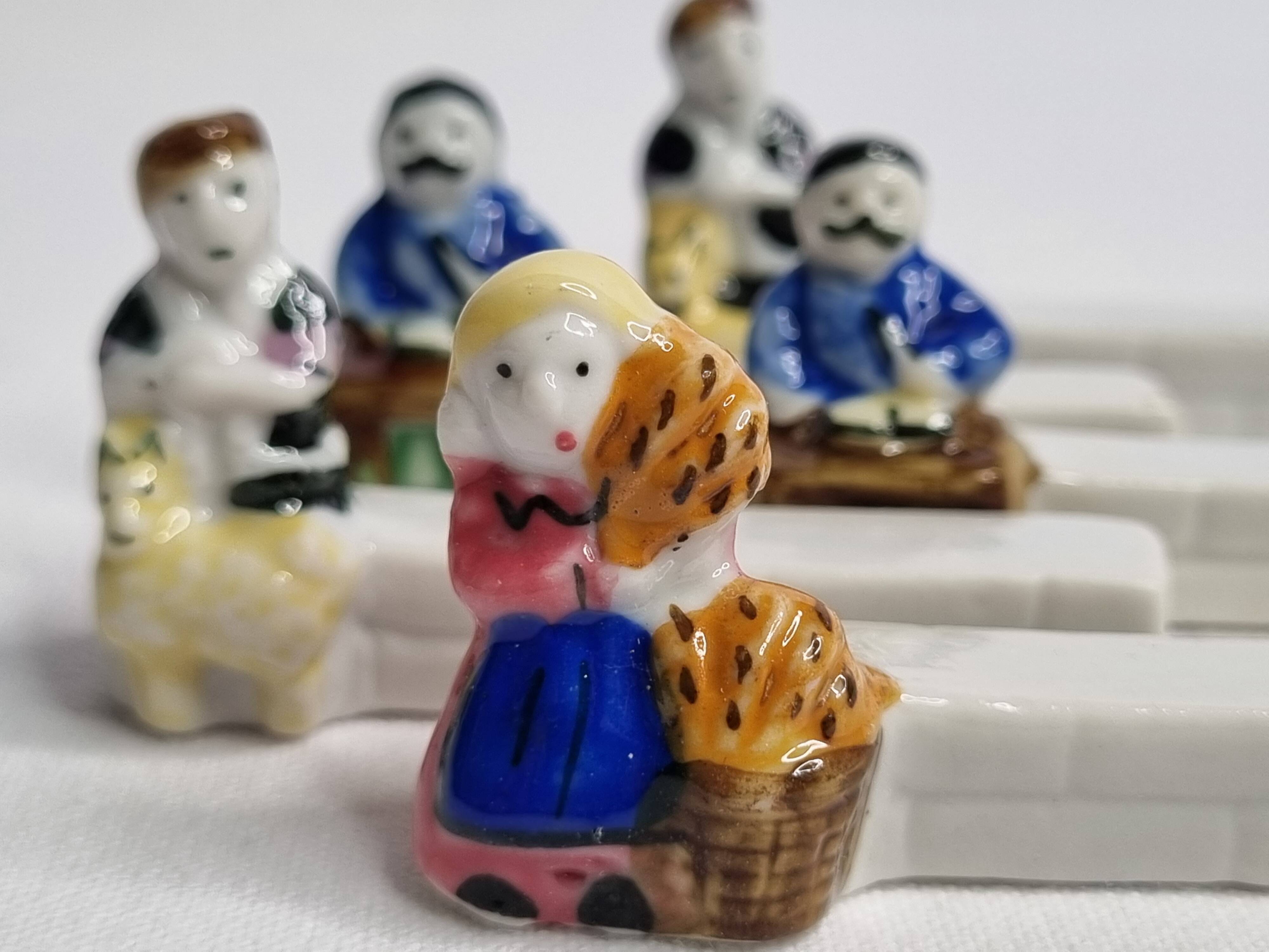 Five porcelain knife holders signed "Le Merzer", 6 cm