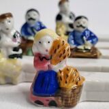 Five porcelain knife holders signed "Le Merzer", 6 cm