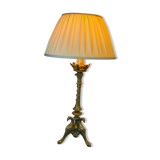 Lampe pique cierge bronze tripodes décor aigle