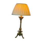 Lampe pique cierge bronze tripodes décor aigle