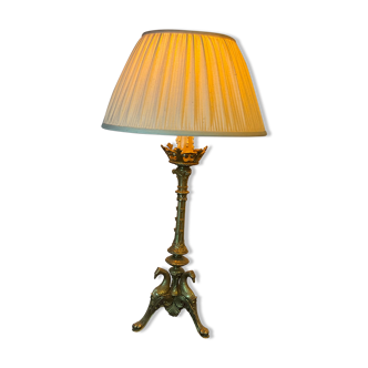 Lampe pique cierge bronze tripodes décor aigle