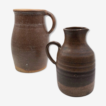 Two old sandstone carafes