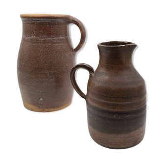 Two old sandstone carafes