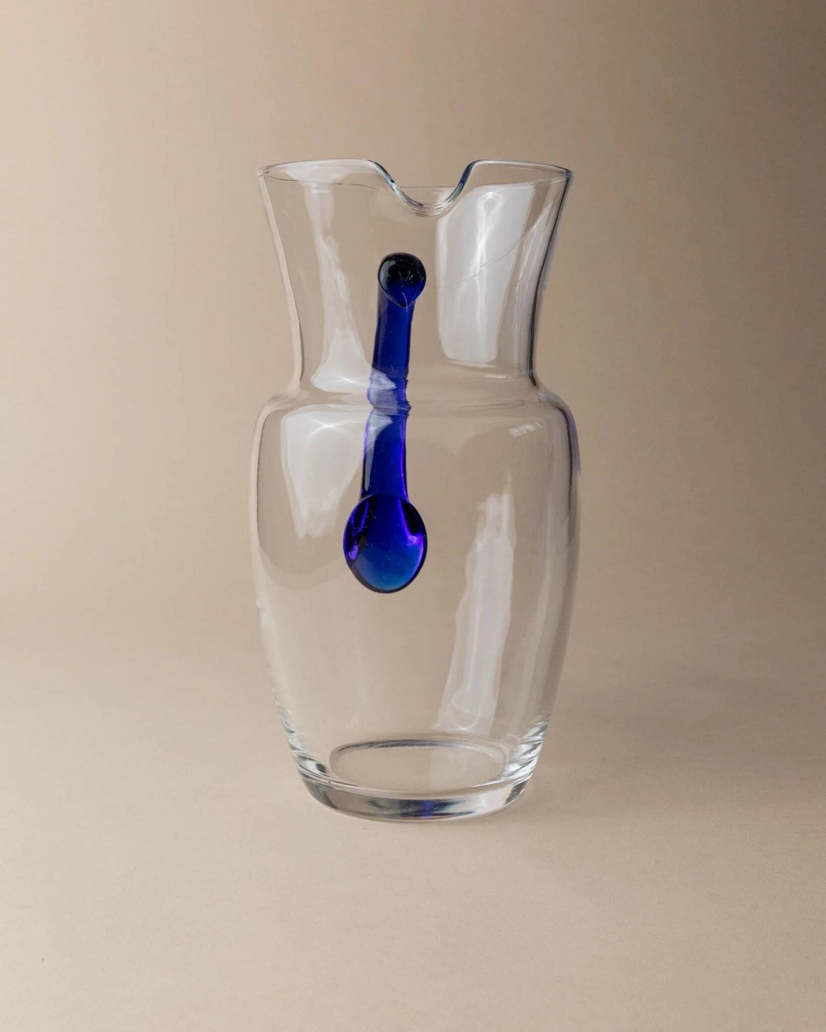 Vintage glass pitcher - clear glass with blue handle - Mid-Century design from Italy in the 1970s - elegant table decoration, retro gift idea.