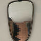 Asymmetrical free-form mirror from the 60s and 70s