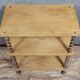 Natural wood display shelf with three tiers