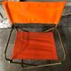 Fauteuil pliant tube métal noir avec tissu orange années 70 vintage