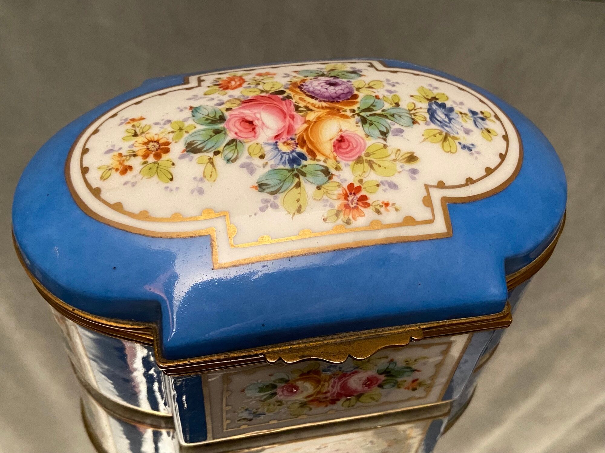 Domed porcelain box polychrome floral decoration on blue background brand Sèvres