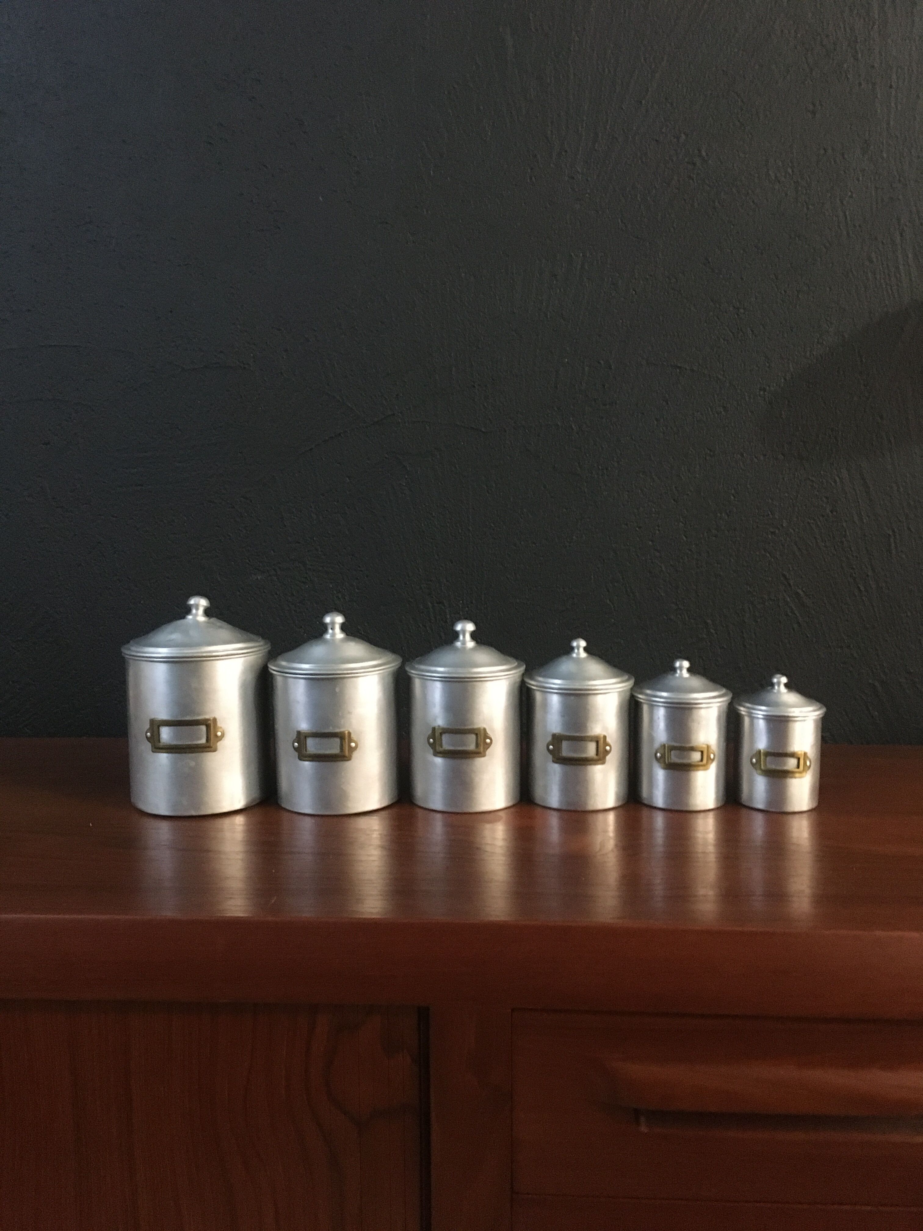 Six aluminum spice pots