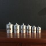Six aluminum spice pots