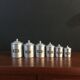 Six aluminum spice pots