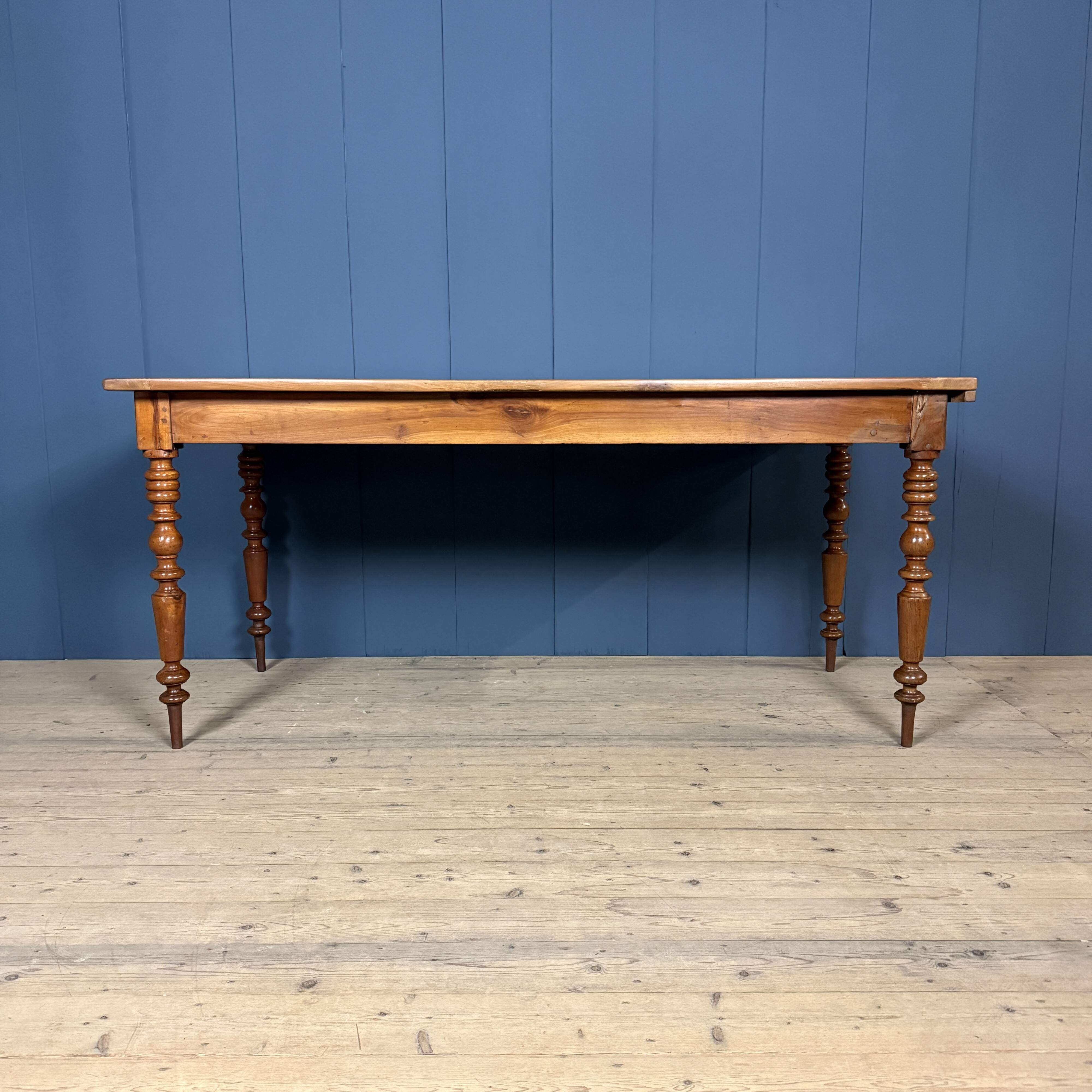 Antique cherry wood dining table from France.
