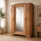 Art Deco wardrobe with bevelled mirror in solid raw walnut.