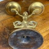 Mermaid-shaped chandelier in bronze