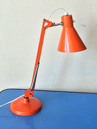 Luxo L9 orange single-arm lamp on plinth