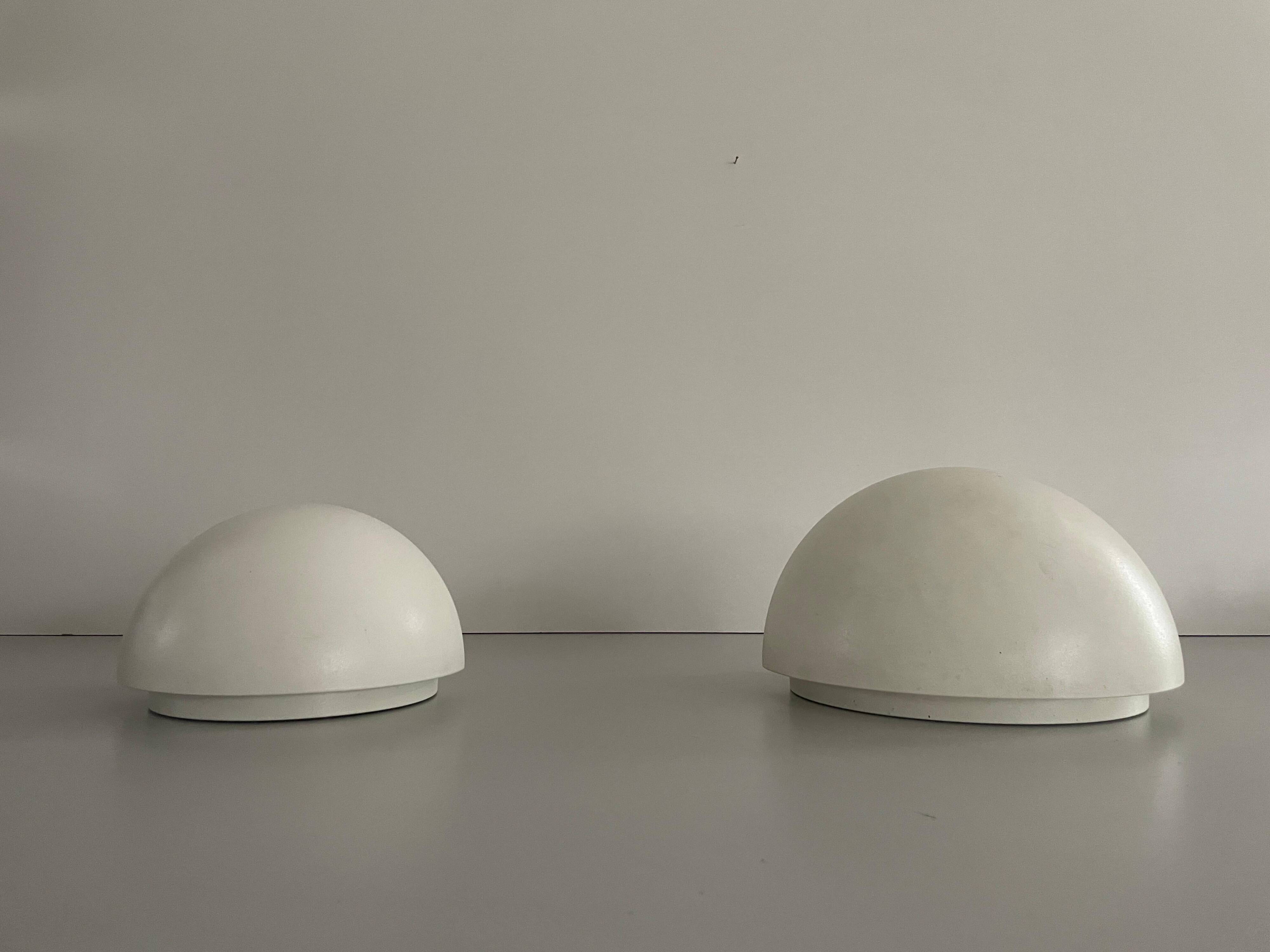 Round wall lights, small and large, in white metal by Bega, 1970s, Germany.