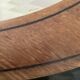 Oval beveled mirror surrounded by light wood dimension: height -74,5cm- width -38,5cm- prof-2cm-
