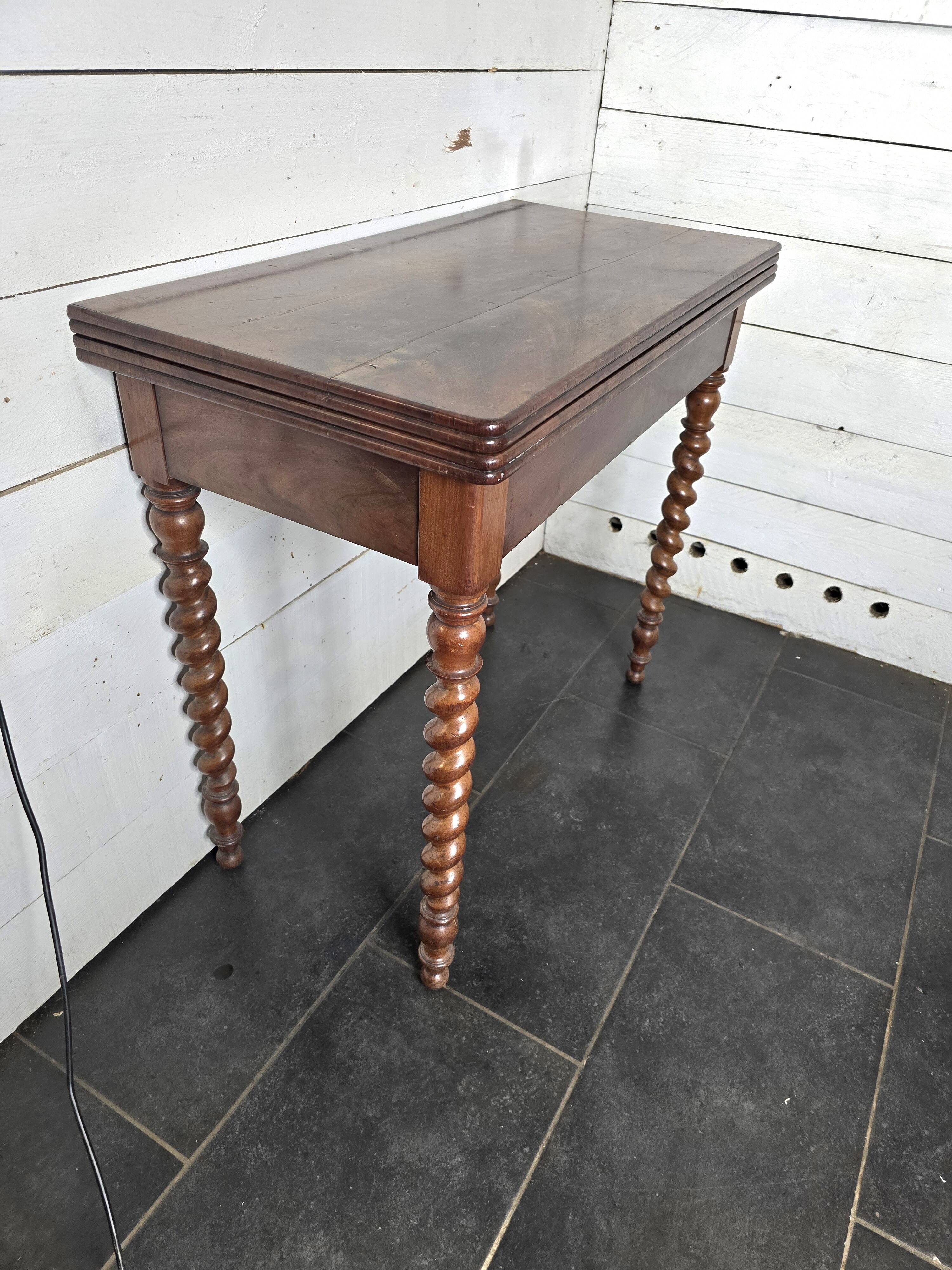 Old mahogany game table