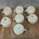 Set of 7 vintage cups Moulin des Loups – Blue and ochre trim, retro charm