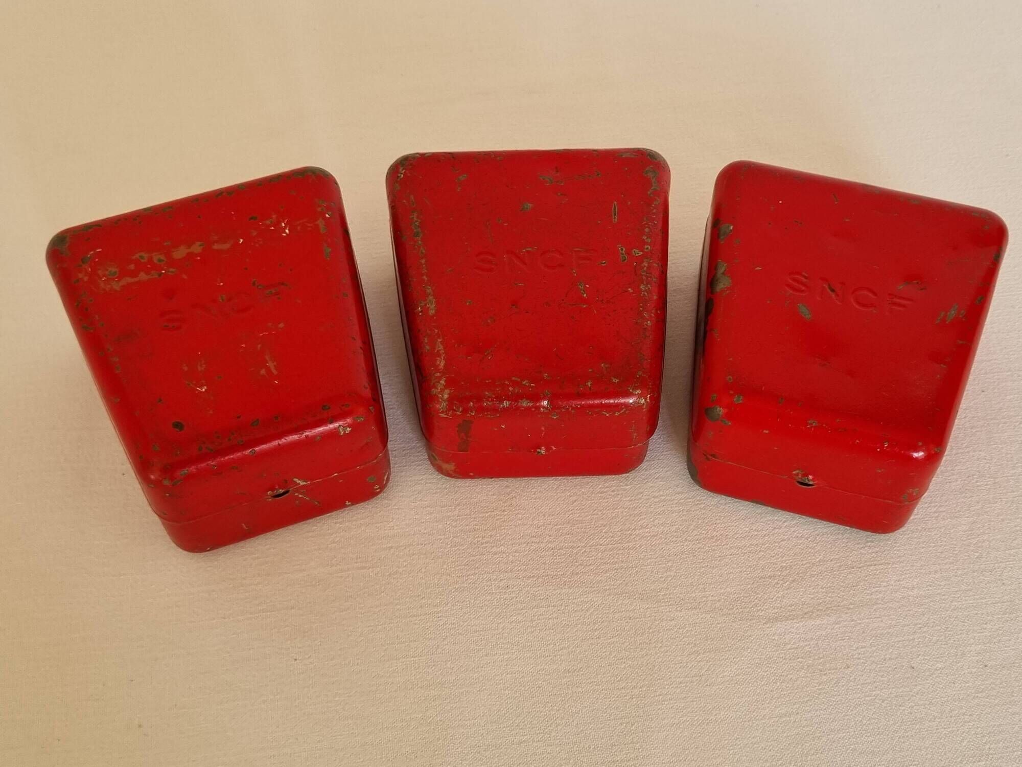 Set of three red painted metal railway boxes with SNCF logo