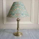 Brass candlestick lamp with its fabric lampshade by William Morris