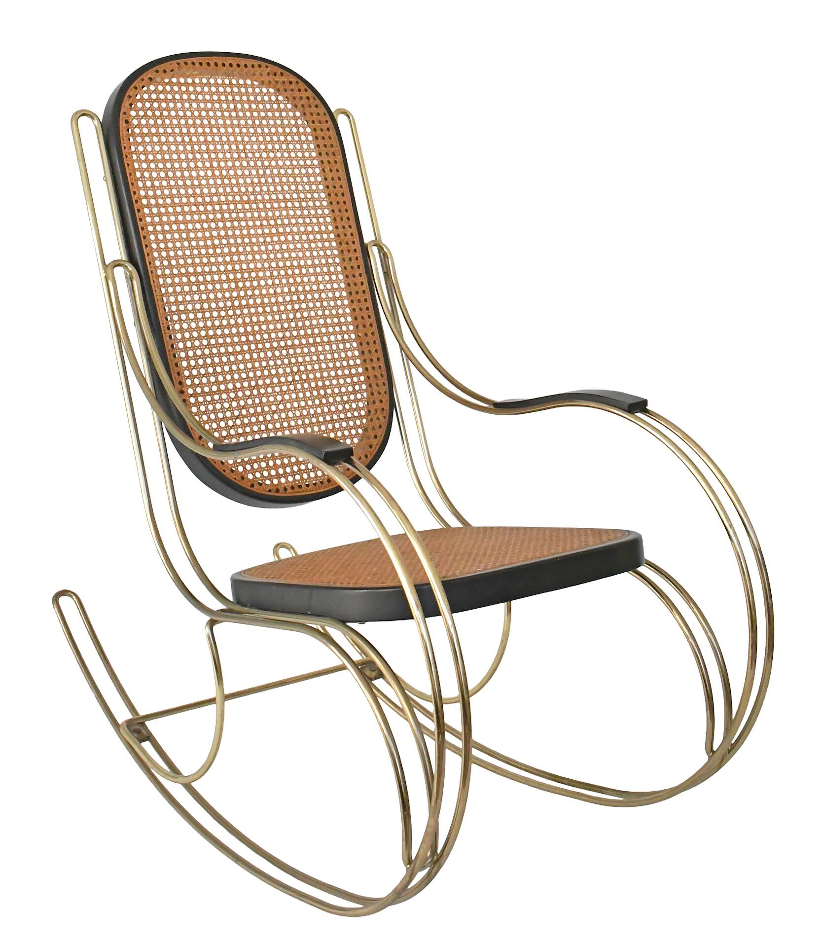 Modernist rocking chair in gilded brass and cane.