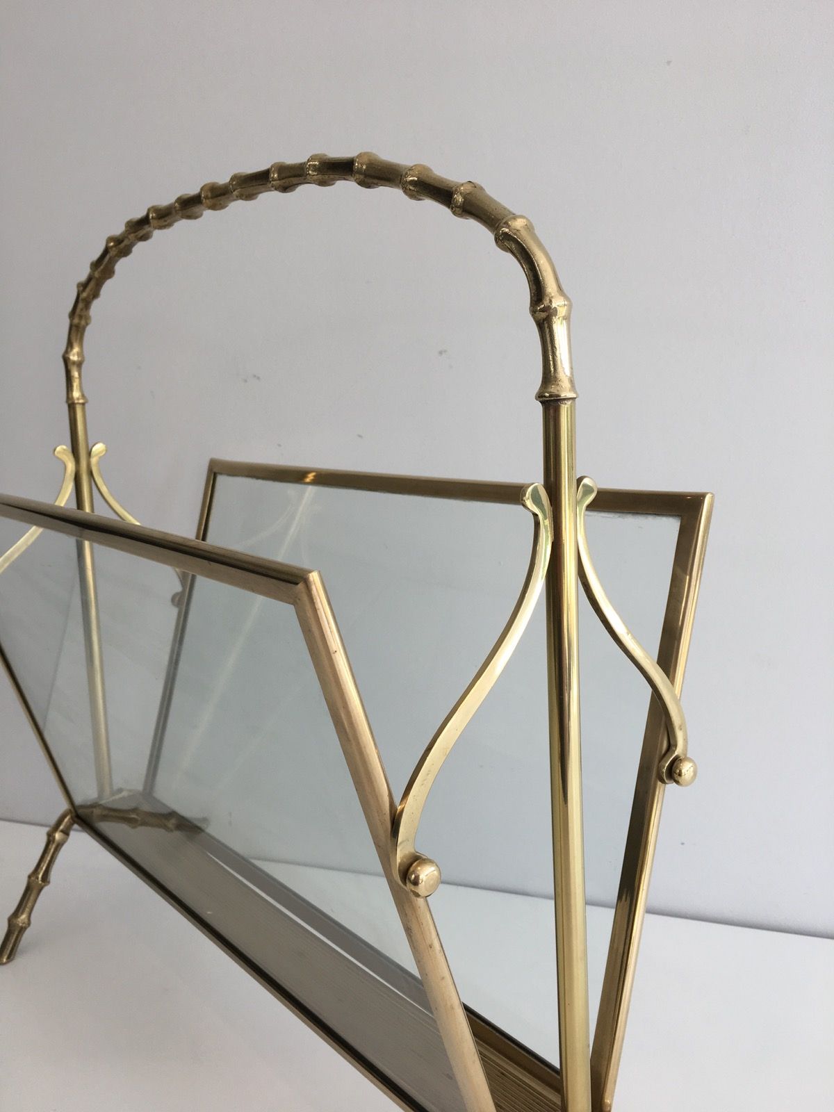 Bamboo-style brass magazine rack from the Baguès house.