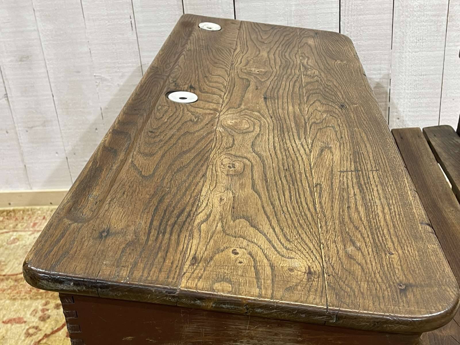 Early 20th-century oak school desk with porcelain inkwells
