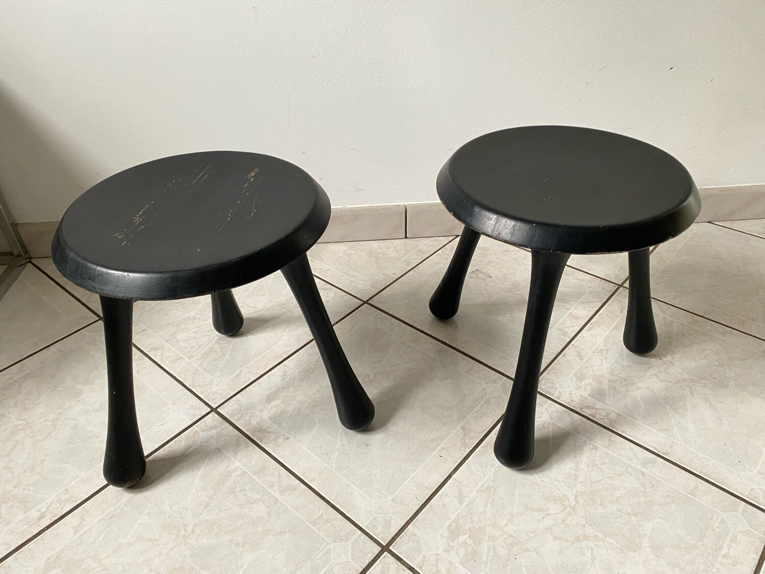 Pair of Ingvar Kamprad design tripod low stools, Habitat edition
