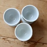 Vintage white porcelain egg cups with floral pattern