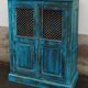 Old wooden cabinet with doors with grille