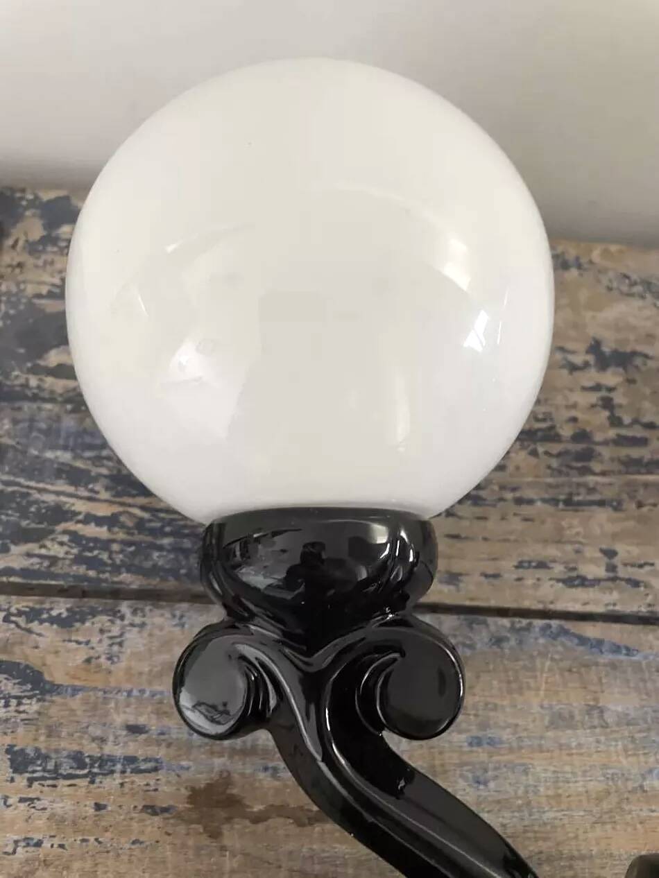 Pair of vintage enameled cast iron wall sconces