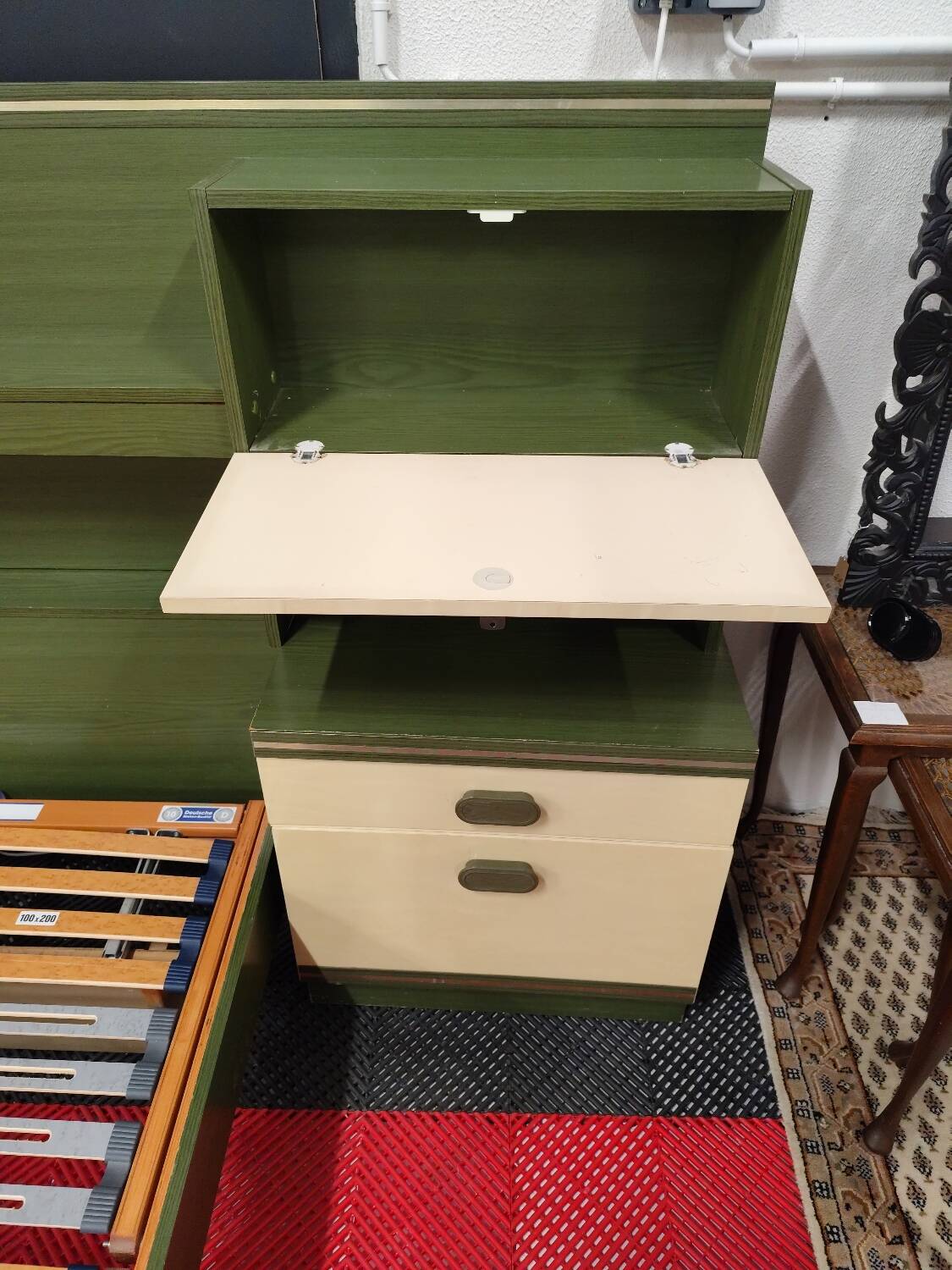 Vintage king-size bed with headboard furniture and built-in radio.