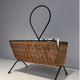Rattan and black lacquered metal magazine rack