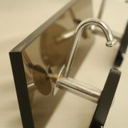 Brown smoked glass coat hook from the 1970s.