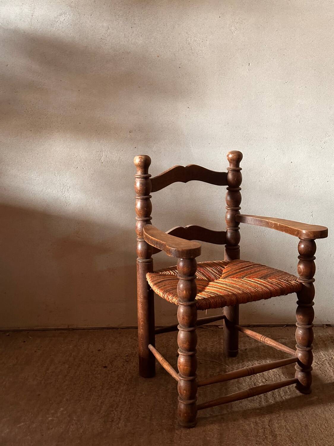 Pair of French spindle chairs in the style of Charles Dudouyt.