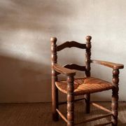 Pair of French spindle chairs in the style of Charles Dudouyt.