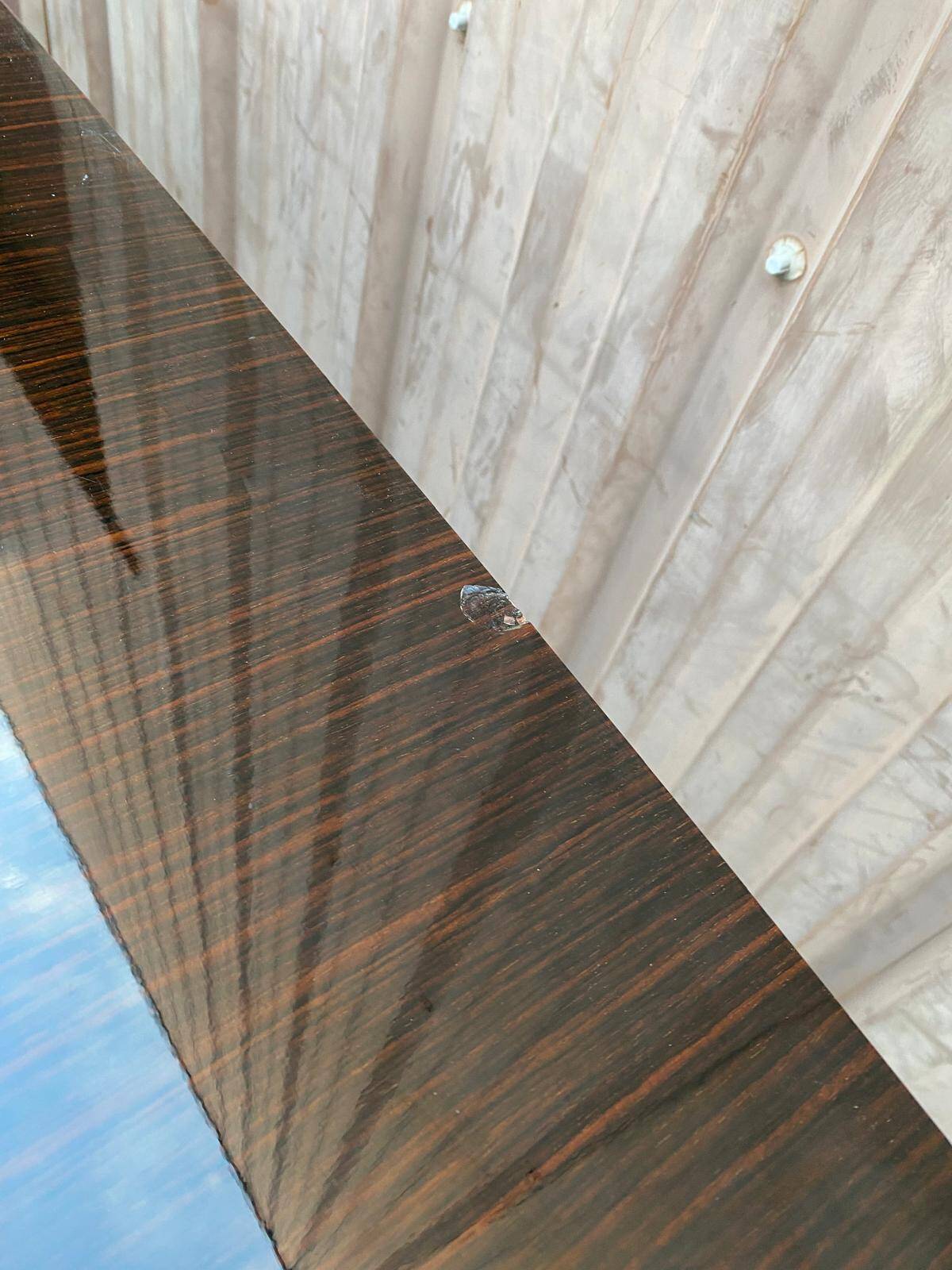 Scandinavian extendable dining table made of solid wood and rosewood effect.