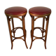Paire de tabourets de bistrot en bois tourné et assise en skaï rouge XX siècle